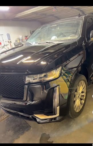Black SUV showing front bodywork and paint finish