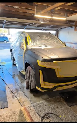 SUV masked in preparation for paint